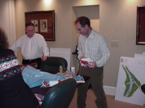 Tony and John opening gifts